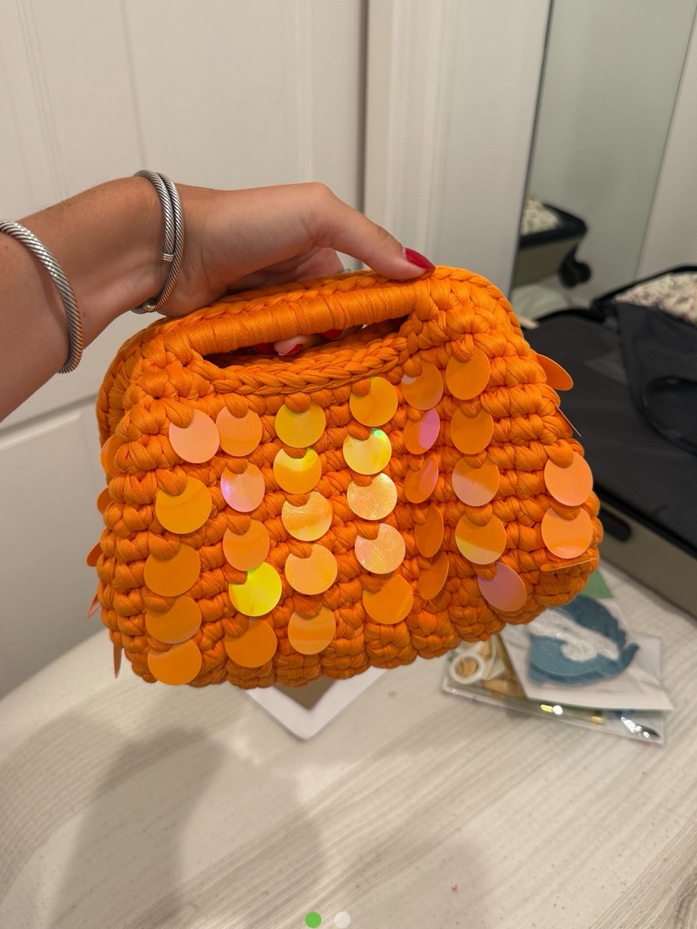 Orange crotchet sequin clutch bag